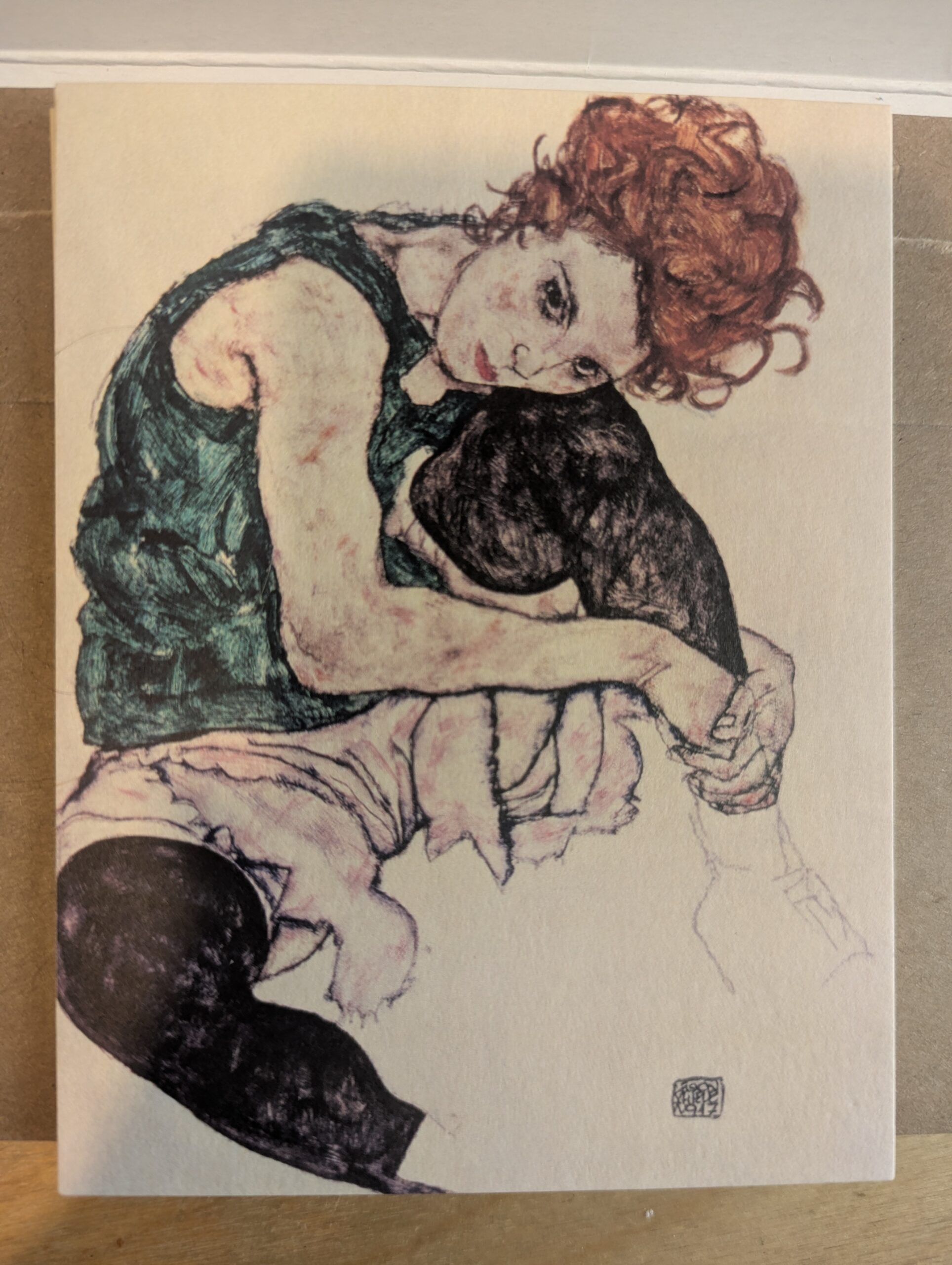 Postcard featuring Seated Woman with Bent Knees,
1917 drawing by Egon Schiele